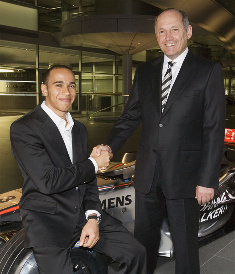 Lewis Hamilton is congratulated by Ron Dennis on signing for McLaren