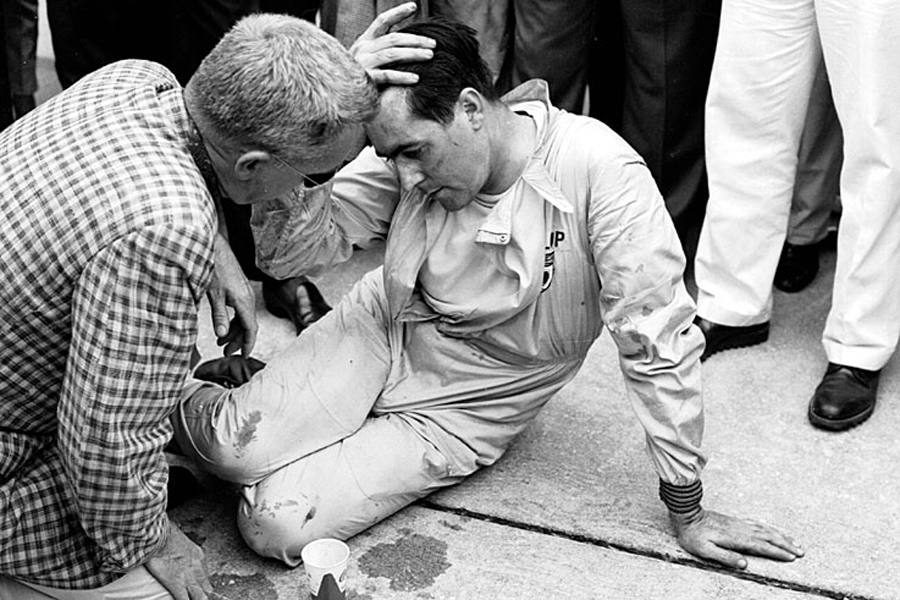 An exhausted Jack Brabham after pushing his car over the line to secure his first world championship