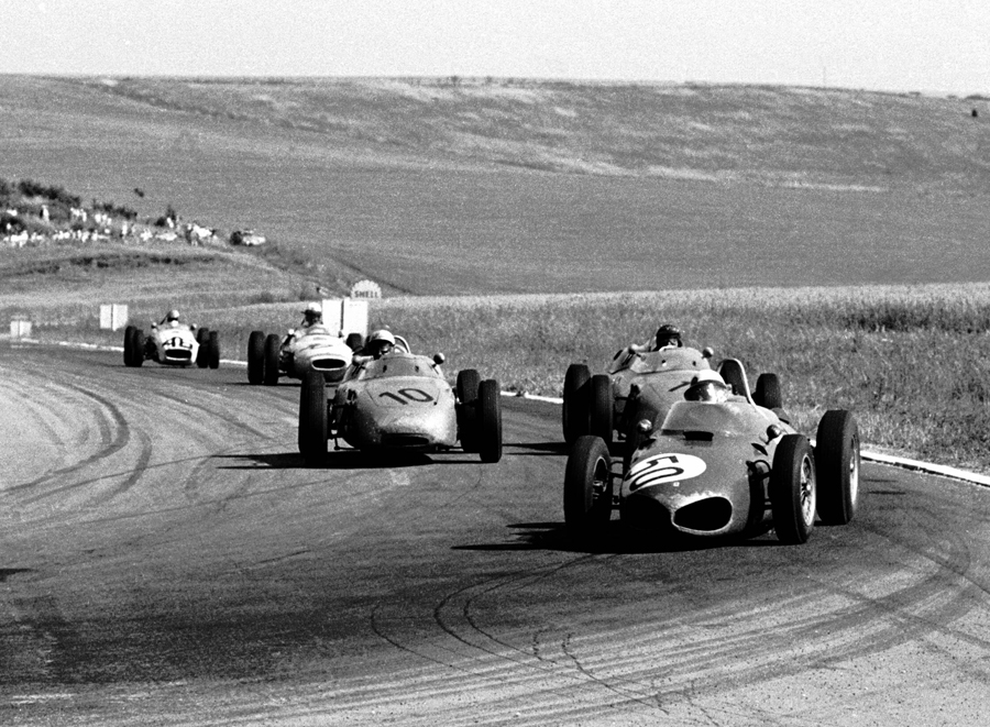 Giancarlo Baghetti in a Ferrari 156 leads the Porsches 718 of Dan Gurney  and Jo Bonnier on his way to victory at the French GP