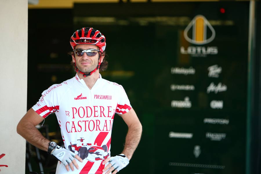 Jarno Trulli in his cycling gear outside the Lotus pits