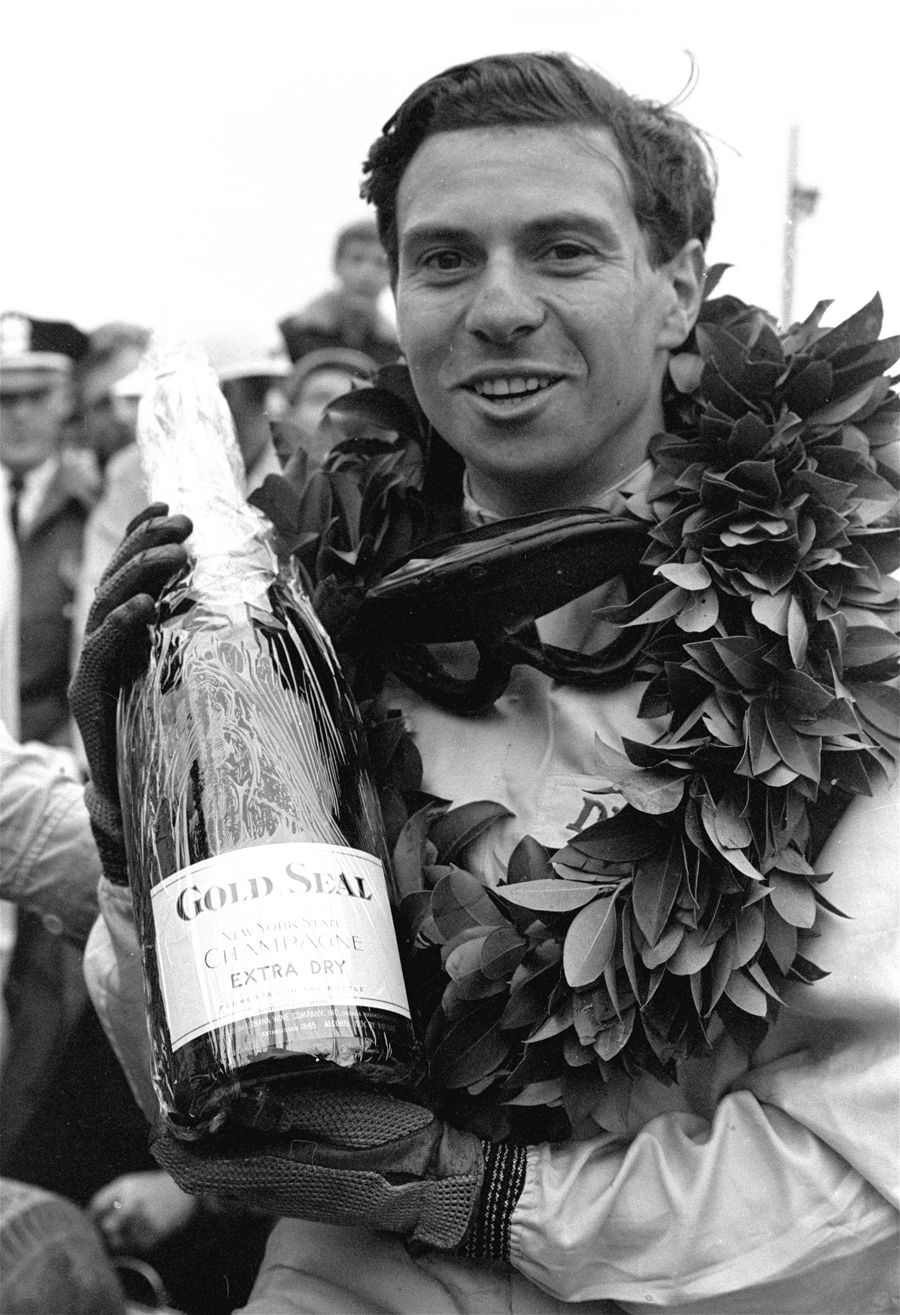 Jim Clark celebrates after he won the Grand Prix of the United States
