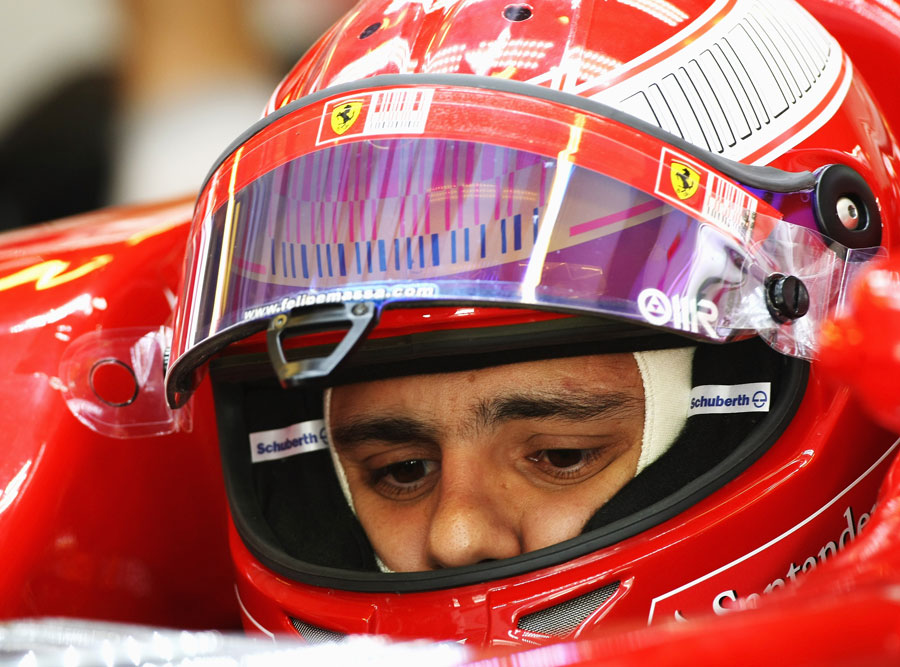 Felipe Massa in the Ferrari cockpit with a new helmet design