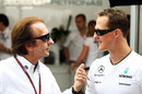 Emerson Fittipaldi chats with Michael Schumacher
