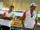 Tonio Liuzzi and Adrian Sutil take in the atmosphere