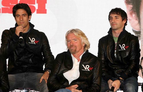 Virgin Racing team-mates Lucas di Grassi and Timo Glock pose with Sir Richard Branson
