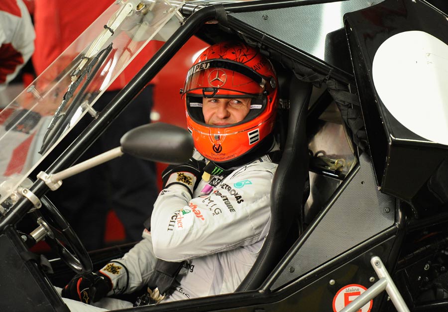 Michael Schumacher sits in his cockpit on day 1 of the Race of Champions