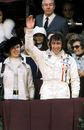 Jackie Stewart celebrates winning the Spanish Grand Prix on the podum with wife Helen