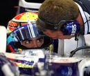 Pastor Maldonado listens to advice in the Williams cockpit
