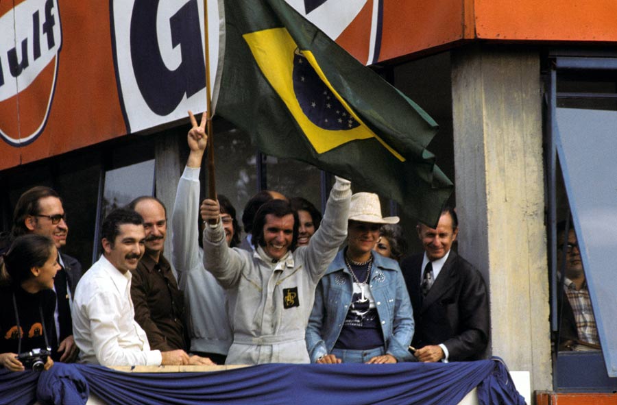 Emerson Fittipaldi celebrates winning the Italian Grand Prix and becoming world champion
