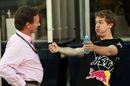 Sebastian Vettel demonstrates his driving to team boss Christian Horner