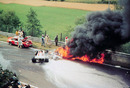 Niki Lauda's Ferrari spews flames after his crash at the Nurburgring