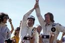 Denny Hulme acknowledges moral victor Ronnie Peterson who lost the win on the penultimate lap with a slow puncture