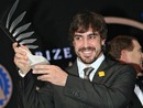 Fernando Alonso holds his trophy for finishing second in the drivers' championship