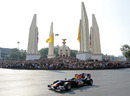 Mark Webber takes his Red Bull past the Democracy Monument