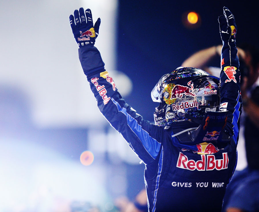 Sebastian Vettel celebrates his title victory in front of the world's media