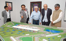 Bernie Ecclestone, with Indian Grand Prix representatives, look at the Jaypee International Race Circuit model