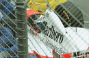 Mika Hakkinen lies unconcious in his McLaren after a near-fatal accident during qualifying for the Australian Grand Prix