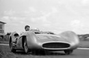 Juan Manuel Fangio guides the sleek Mercedes W196 towards the apex