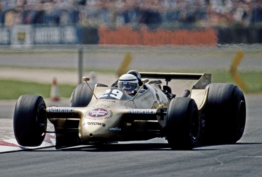 Riccardo Patrese lifts an inside wheel in the Arrows A2