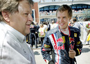 Norbert Haug gives Sebastian Vettel a few words of advice on the grid