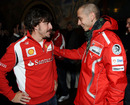 Fernando Alonso shares a joke with Moto GP legend Valentino Rossi