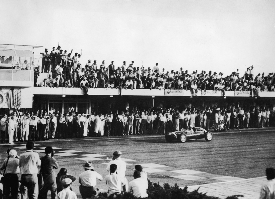 Stirling Moss crosses the line to win the Argentine Grand Prix