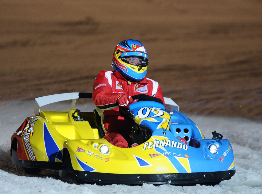 Fernando Alonso takes part in an ice-karting race