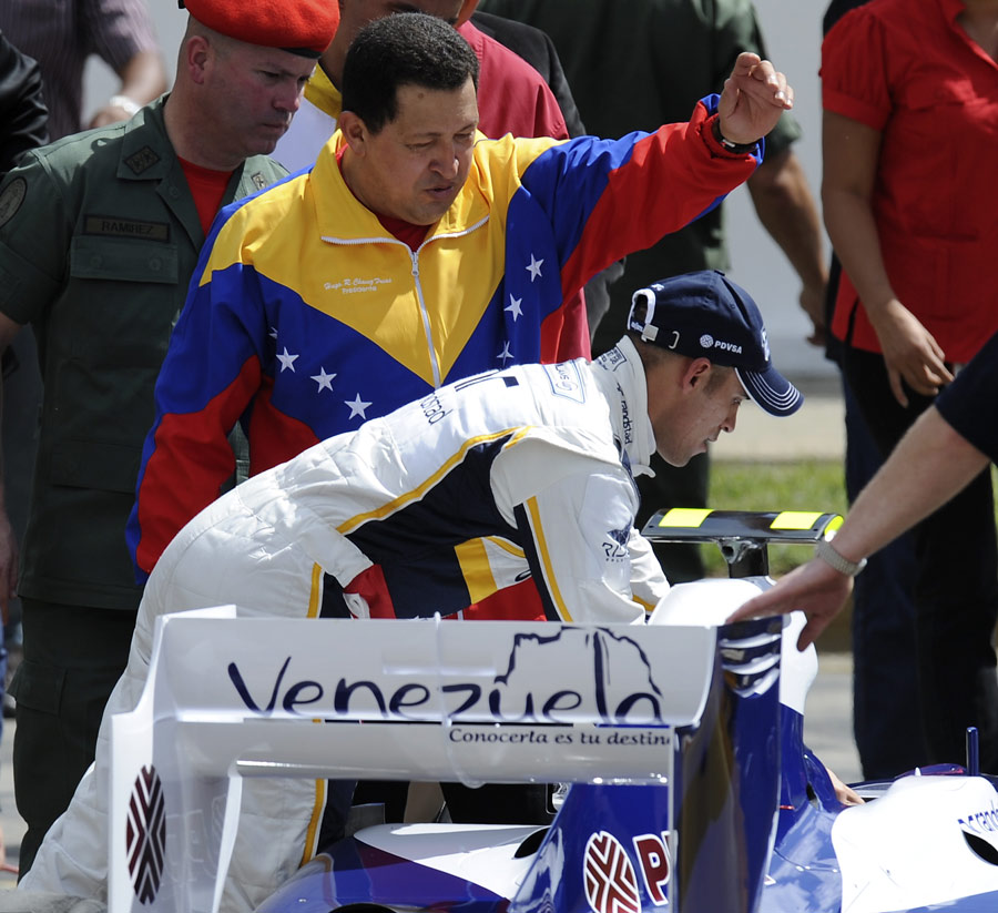 Pastor Maldonado and Venezuela president Hugo Chavez inspect a Williams F1 car