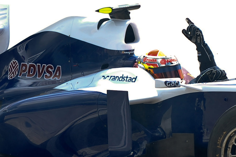 Pastor Maldonado waves from the cockpit of his Williams