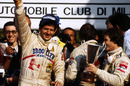 Jody Scheckter celebrates on the podium with second placed team-mate Gilles Villeneuve 