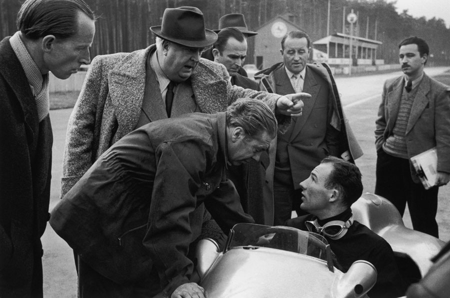Alfred Neubauer gives orders to his new driver Stirling Moss during a test at Hockenheim