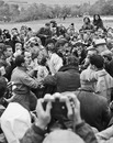 Graham Hill is mobbed after winning the US Grand Prix