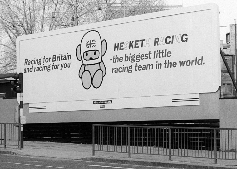 A billboard advert for the Hesketh team, proclaiming itself 'The biggest little racing team in the world.'
