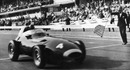 Tony Brooks takes the chequered flag to win the 1958 Belgian Grand Prix