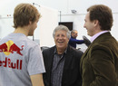 Mario Andretti shares a joke with Sebastian Vettel and Christian Horner