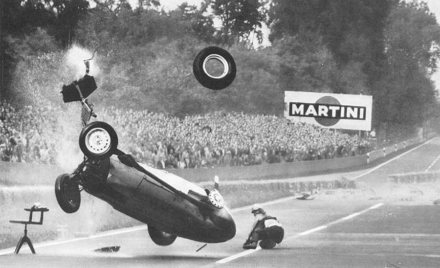Hans Herrmann watches as his BRM somersaults away from him
