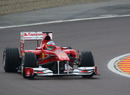Fernando Alonso slides the Ferrari F150 during its first run on wet tyres