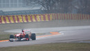 Fernando Alonso uses wet tyres in cold conditions to give the Ferrari F150 its first run