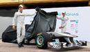 Michael Schumacher and Nico Rosberg prepare to take the covers off the new Mercedes WO2