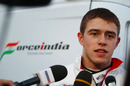 Paul di Resta talks to the press outside the Force India motorhome