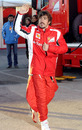 Fernando Alonso waves to fans as he heads home