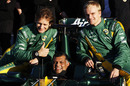 Tony Fernandes poses for photos with Jarno Trulli and Heikki Kovalainen