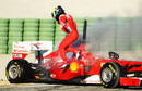 Felipe Massa clambers out of his Ferrari after it caught fire 35 minutes into the final day of testing