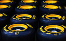 Pirelli tyres stacked up in the paddock