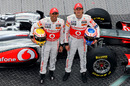 Lewis Hamilton and Jenson Button pose with the new MP4-26