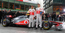 Lewis Hamilton and Jenson Button pose with the new MP4-26
