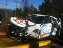 The remains of Robert Kubica's wrecked Skoda Fabia are towed away