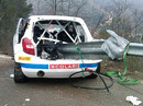 The remains of Robert Kubica's wrecked Skoda Fabia with a guard rail piercing the chassis