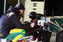 Jarno Trulli tries his hand as a mechanic at Lotus