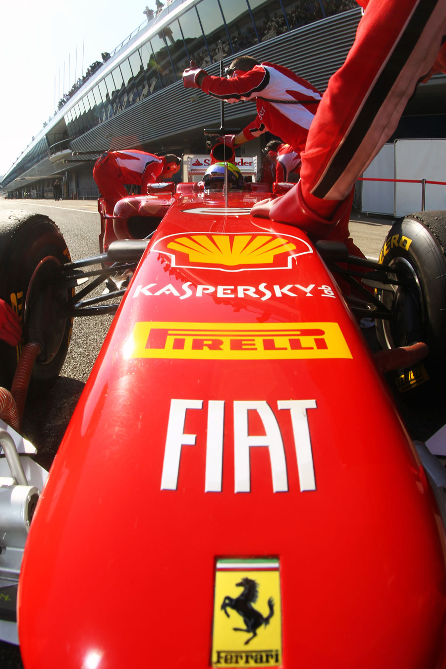 Felipe Massa gets pushed back in to the Ferrari garage